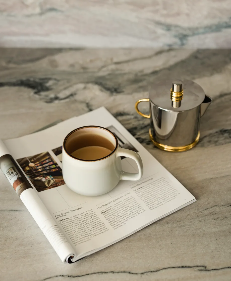 Veined stone countertop meeting painted cabinetry