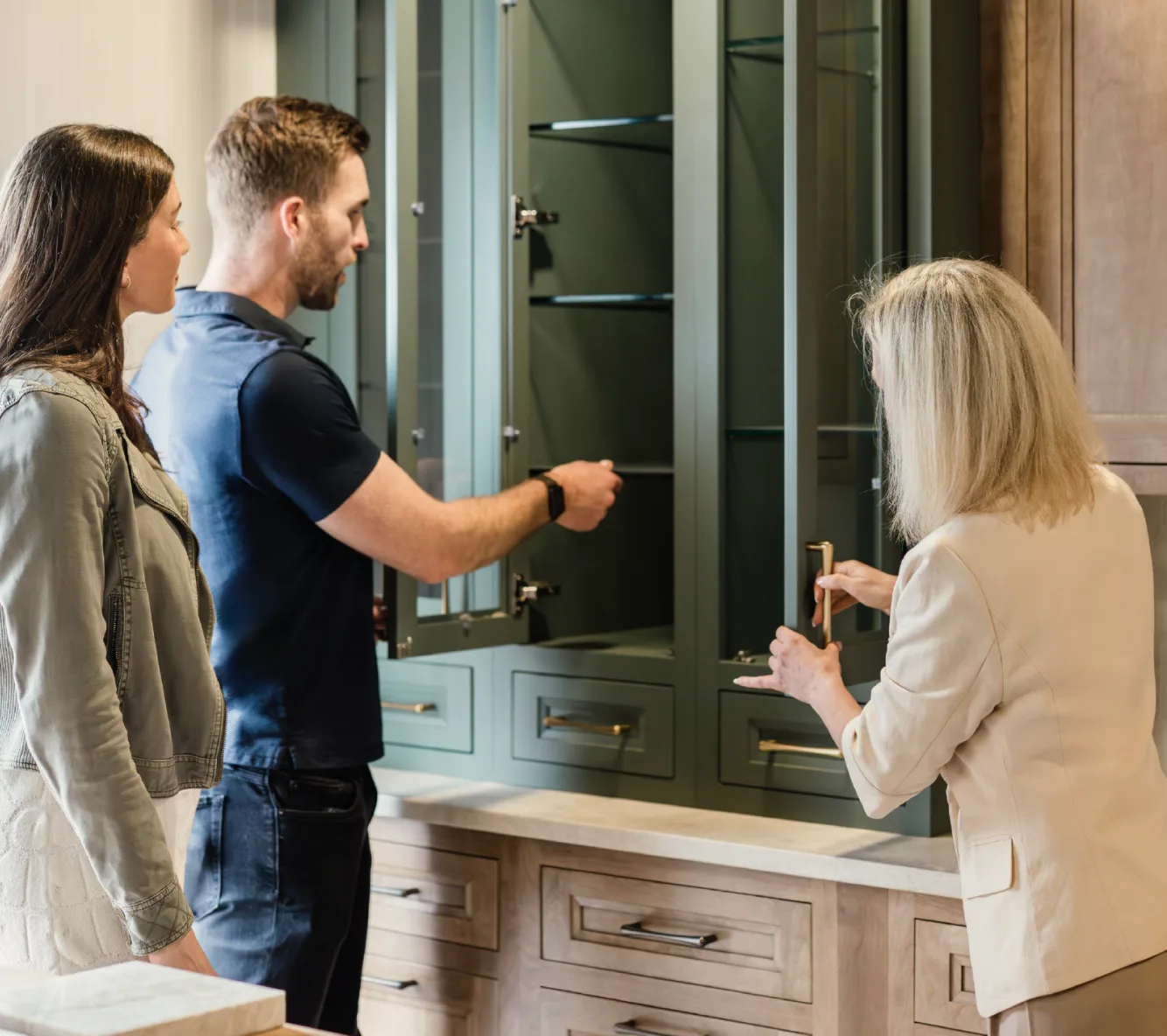 Cabinet IQ designer reviewing cabinetry options with homeowners in the Scottsdale showroom